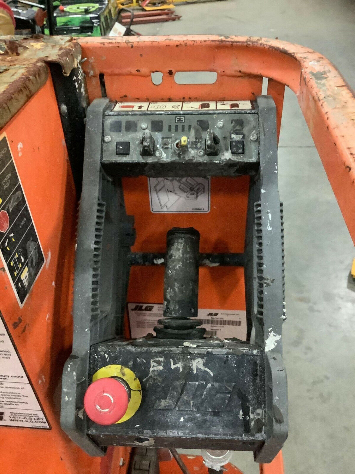 JLG 1230ES MANLIFT, BUILT IN BATTERY CHARGER, 12' PLATFORM HEIGHT