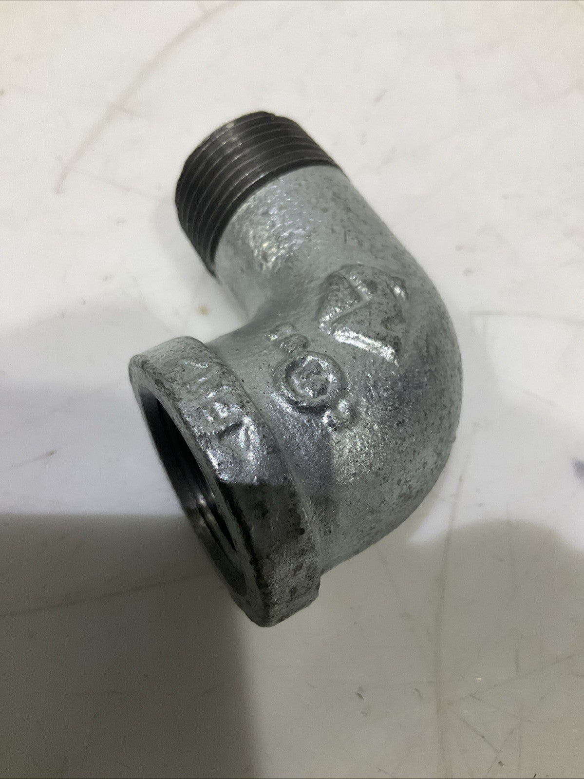 RB  0022081  3/4 GALVANIZED IRON  90 FIP x MIP STREET  ELBOW  IN  PLUG