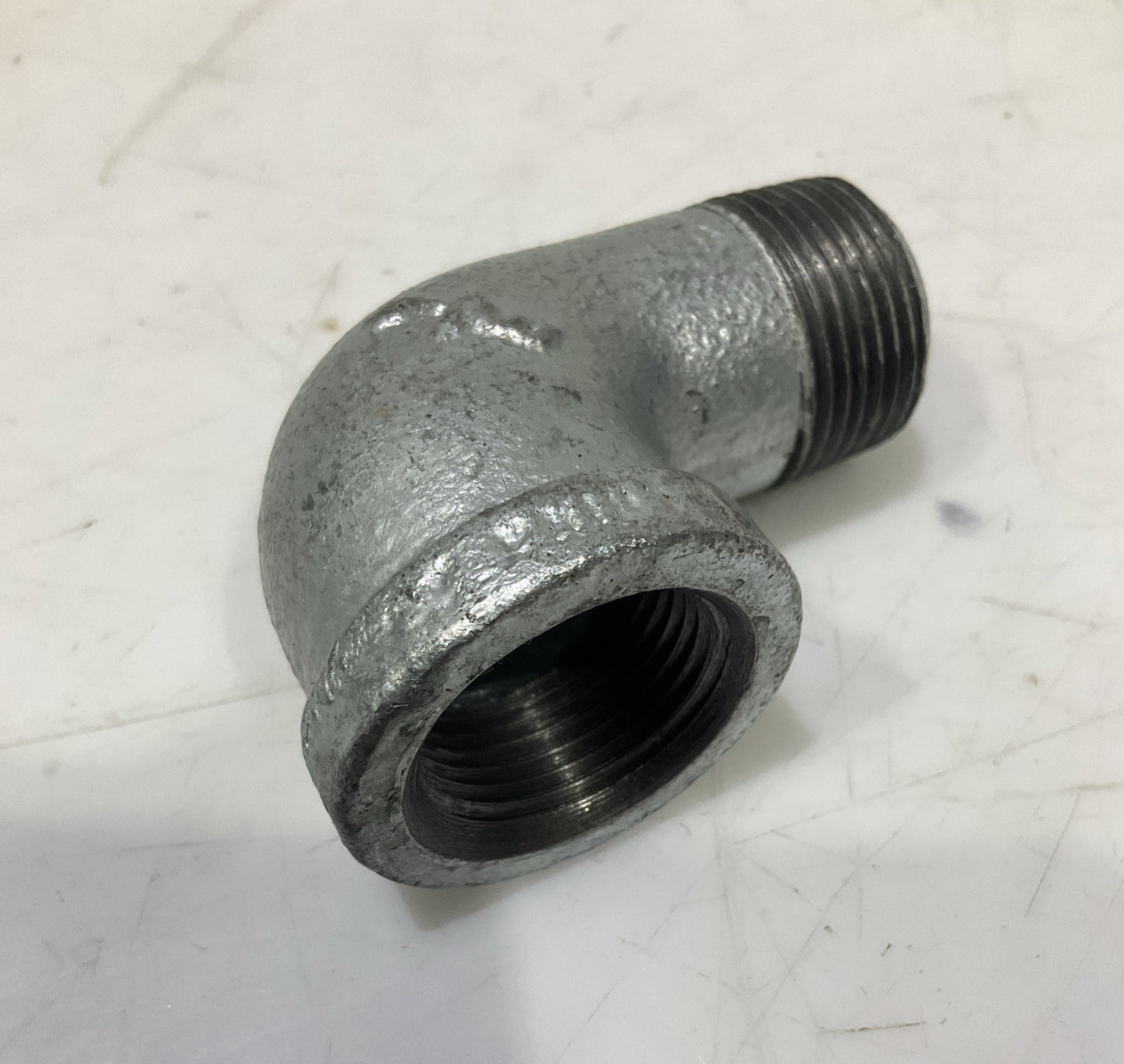 RB  0022081  3/4 GALVANIZED IRON  90 FIP x MIP STREET  ELBOW  IN  PLUG
